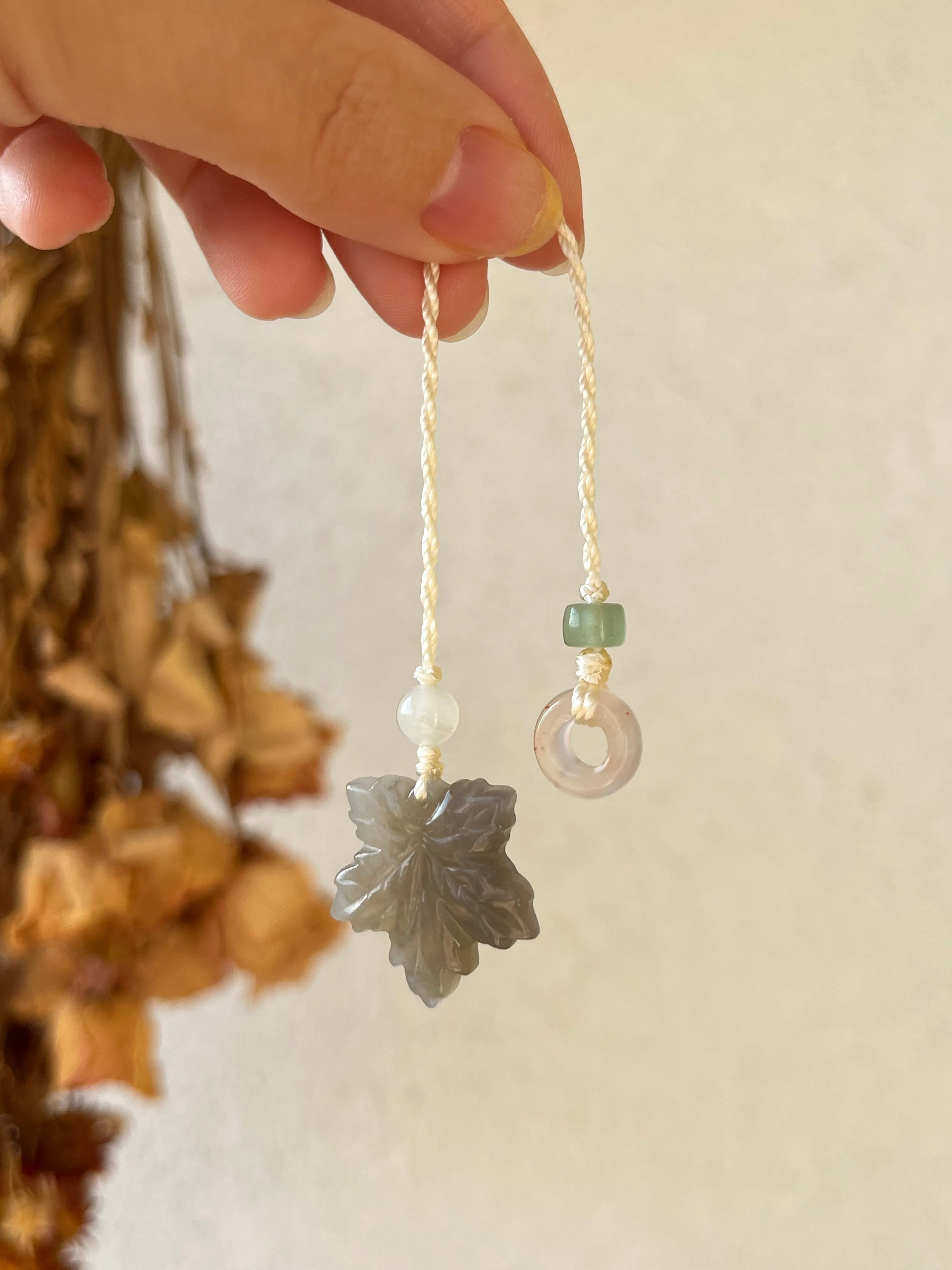 Handmade Phone Charm with a Carved Hetian Jade Maple Leaf and a Nanhong Agate Lucky Ring