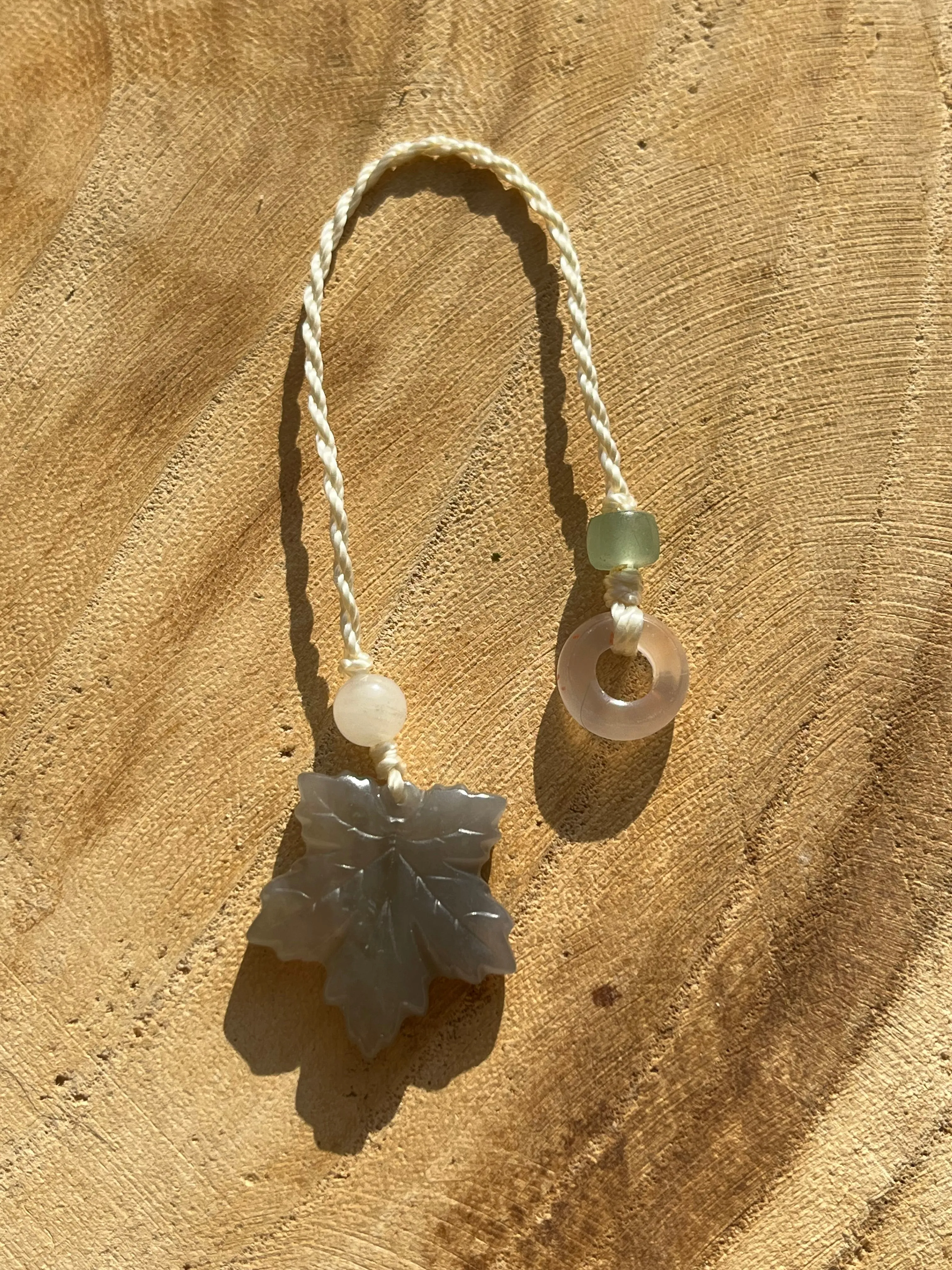 Handmade Phone Charm with a Carved Hetian Jade Maple Leaf and a Nanhong Agate Lucky Ring